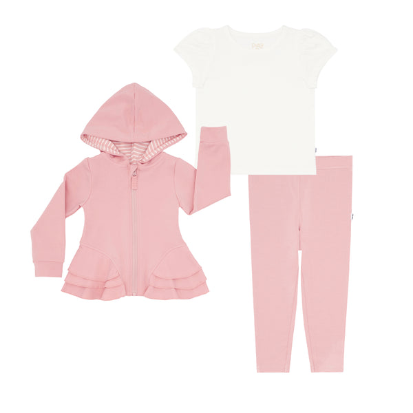flat lay composite of a mauve blush peplum hoodie, soft white puff sleeve tee, and mauve blush legging