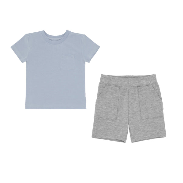 flat lay composite of a fog relaxed pocket tee and heather gray shorts