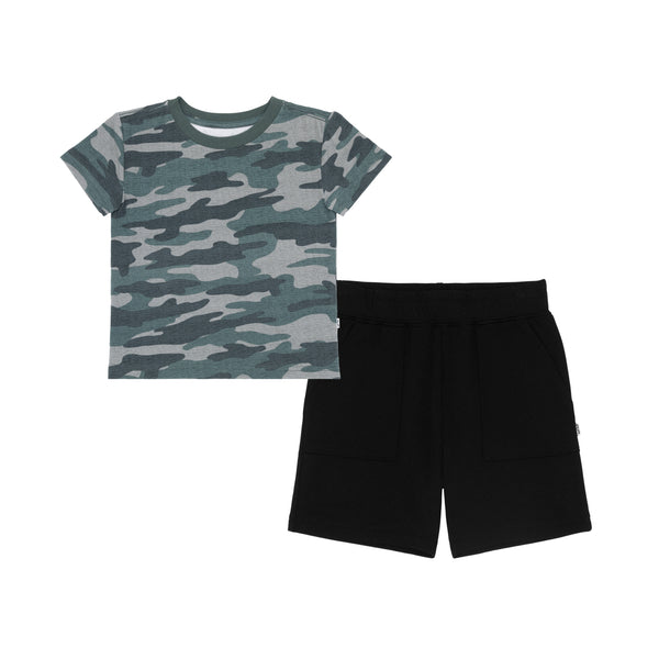 flat lay composite of a vintage camo relaxed tee and black shorts