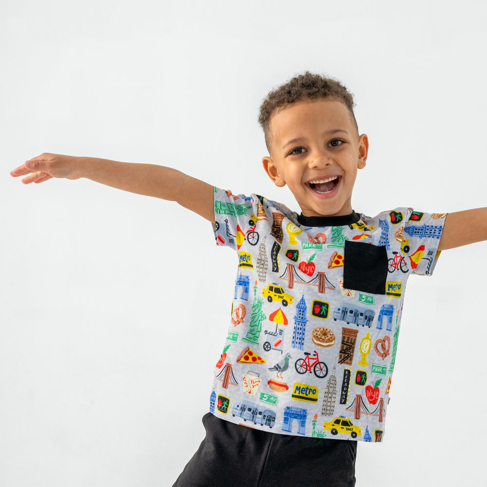 Posing child wearing the The Big Apple Relaxed Pocket Tee