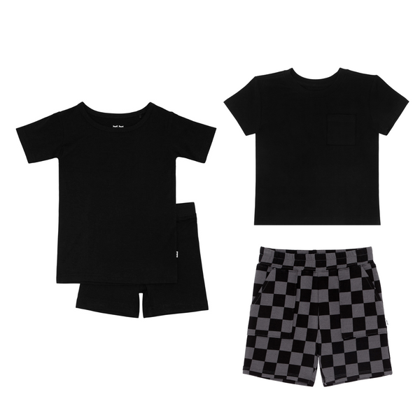 flat lay composite of a black two-piece short sleeve & shorts pajama set, black relaxed pocket tee, and monochrome checks shorts