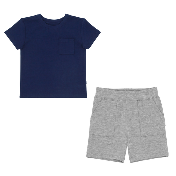 flat lay composite of a classic navy relaxed pocket tee and heather gray shorts