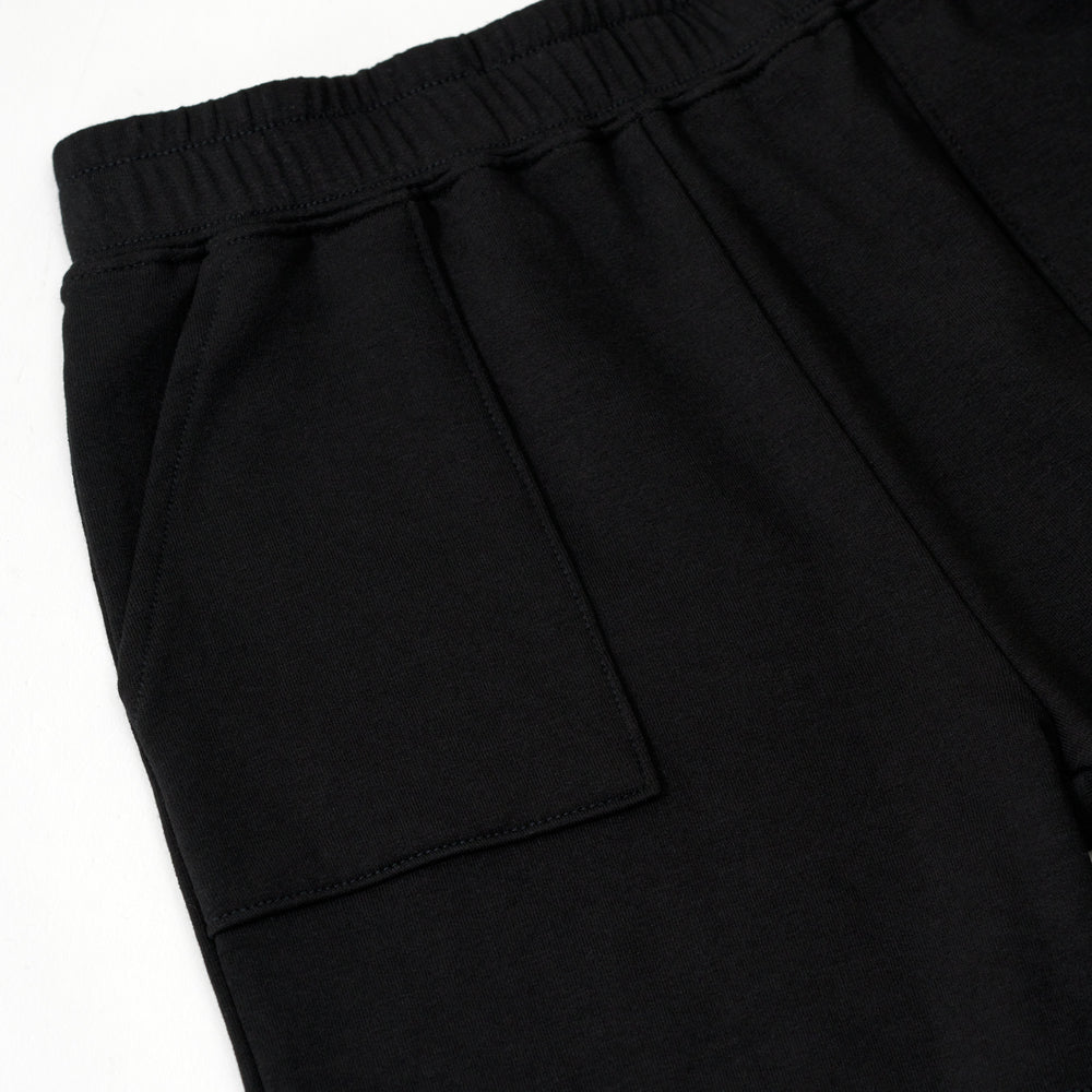 Flat lay image of the pocket detail on the Black Play Shorts