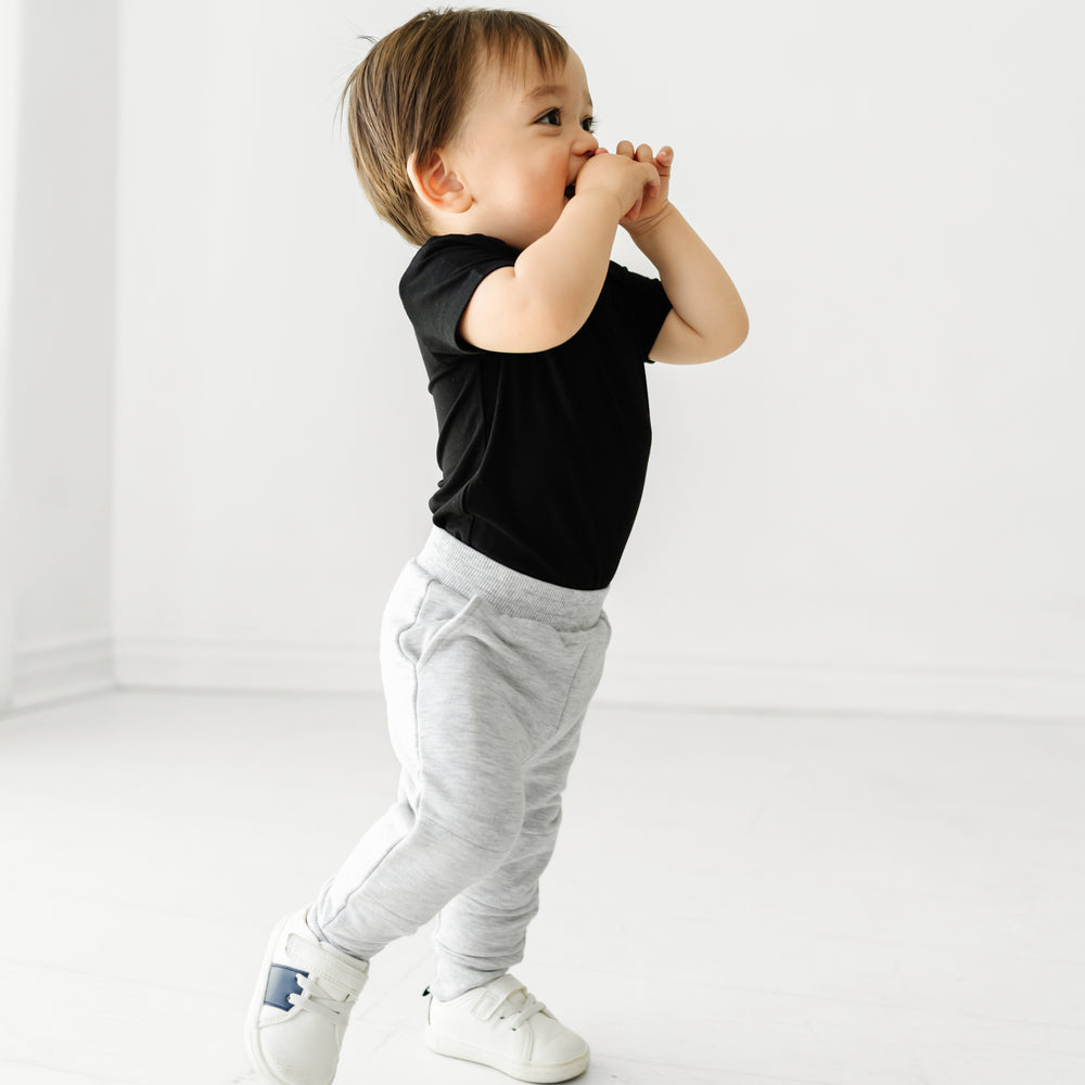 Child wearing a Black bodysuit and coordinating Play joggers