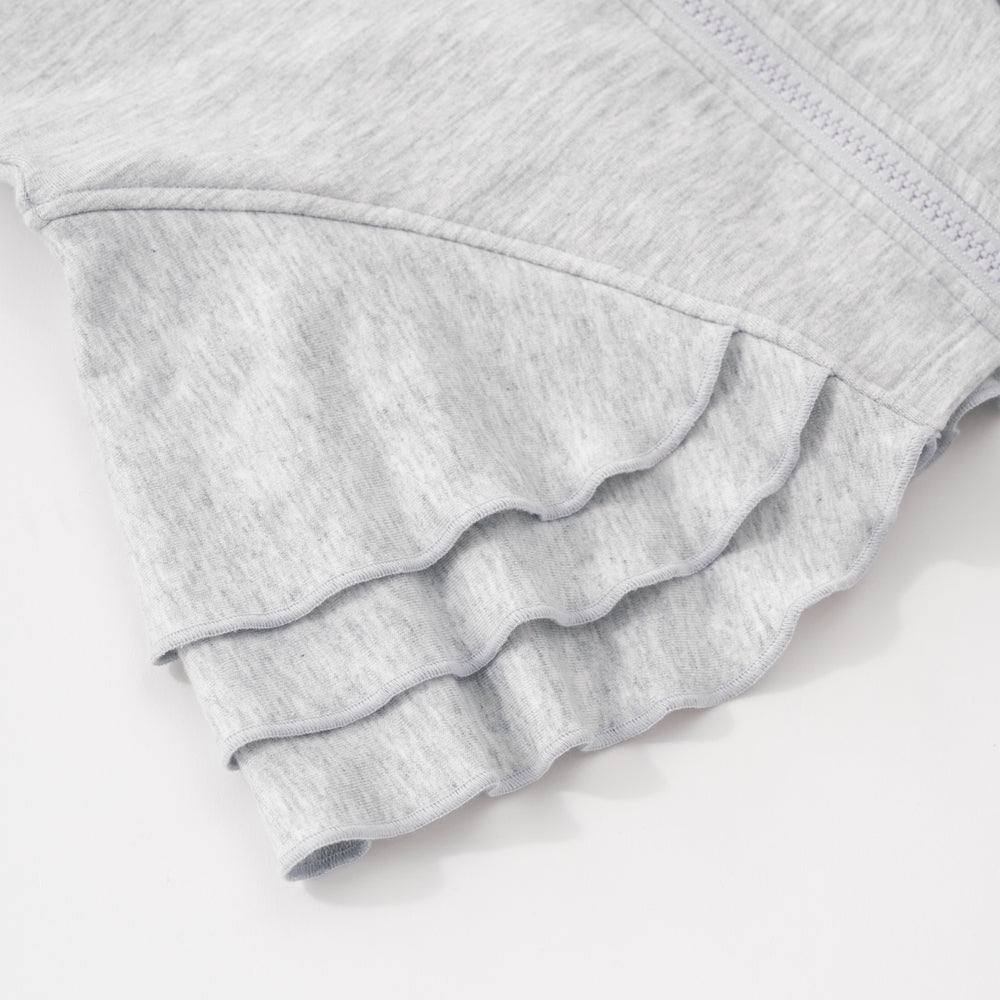 Close up flat lay image of the side peplum detail on the Light Heather Gray Peplum Hoodie