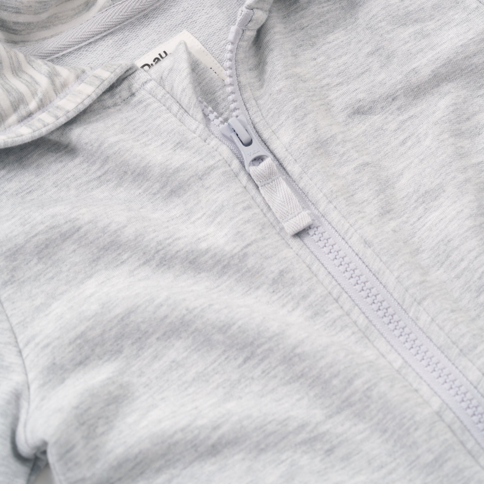 Close up image of the collar and zipper on the Light Heather Gray Peplum Hoodie
