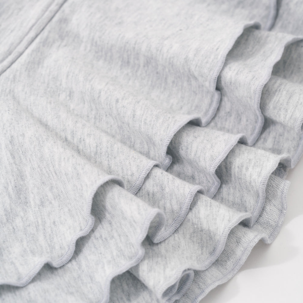 Alternative close up image of the peplum detail on the bottom of the Light Heather Gray Peplum Hoodie