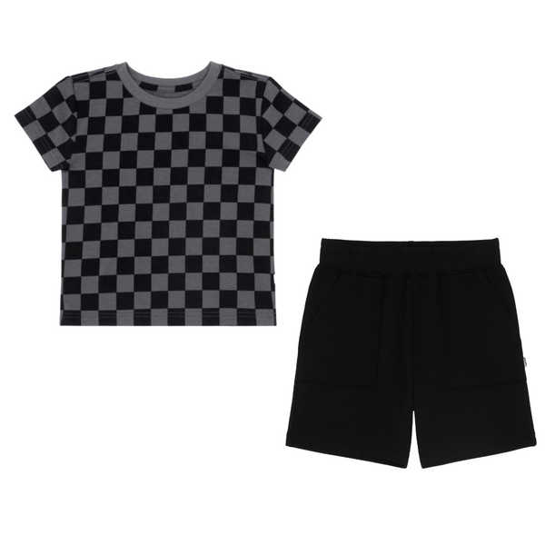 flat lay composite of a monochrome checks relaxed tee and black shorts