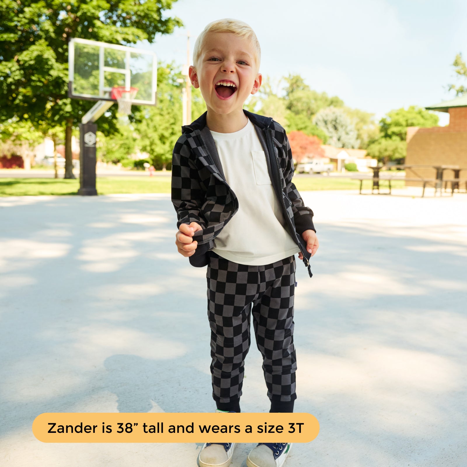 Boy wearing the matching Monochrome Checks Zip Hoodie and Joggers