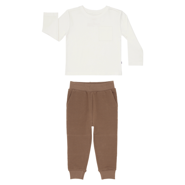flat lay composite of a soft white relaxed pocket tee and vintage brown jogger