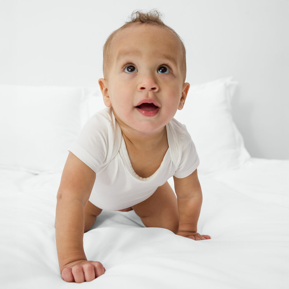 Alternate of crawling baby wearing the Soft White bamboo bodysuit